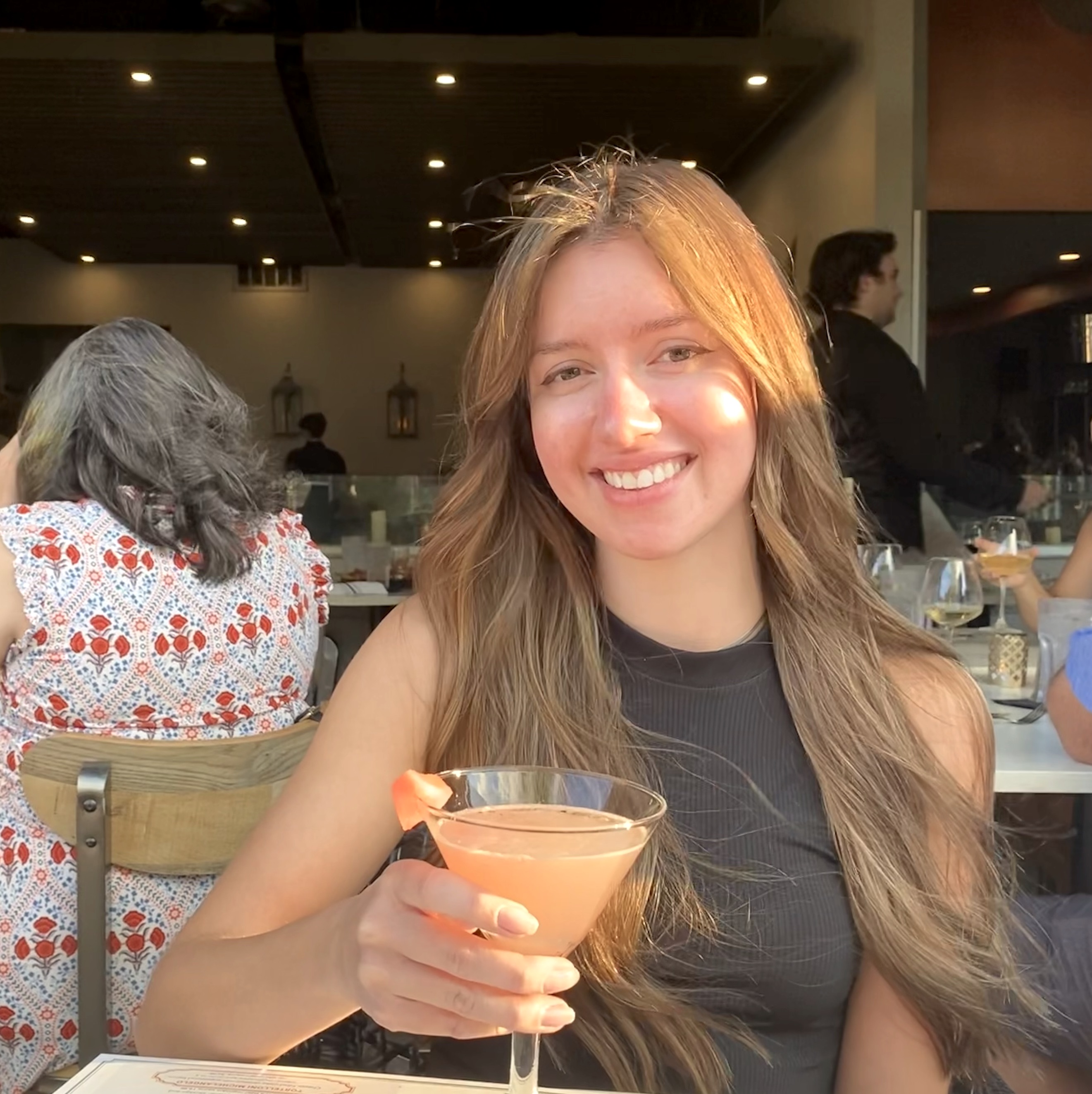 Me at one of my favorite restaurants holding a watermelon cosmo